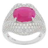 Oval red Moissanite ring in sterling silver, surrounded by sparkling accents, perfect for elegant occasions.